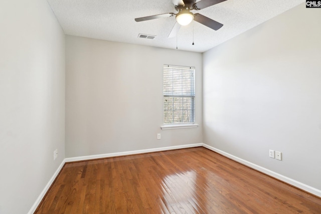 208 Bailey Island Cir, Lexington, SC 29072 - spare room with wood finished floors, visible vents, a ceiling fan, and baseboards