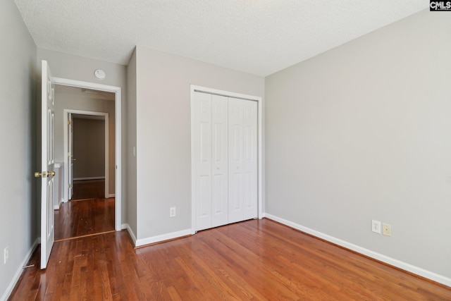 208 Bailey Island Cir, Lexington, SC 29072 - unfurnished bedroom with baseboards, wood finished floors, and a closet