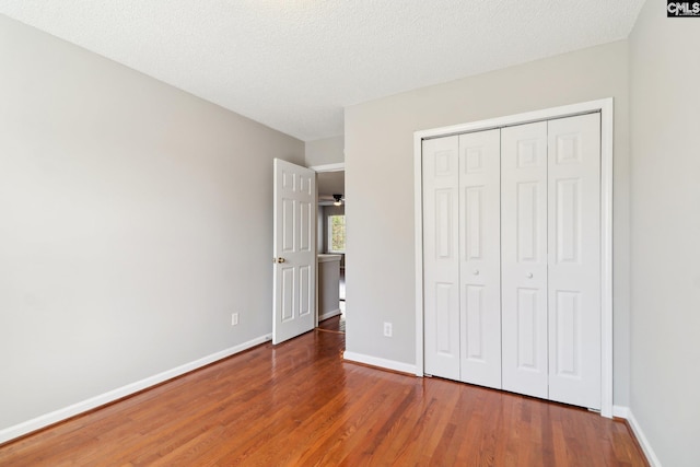 208 Bailey Island Cir, Lexington, SC 29072 - unfurnished bedroom featuring a closet, wood finished floors, and baseboards