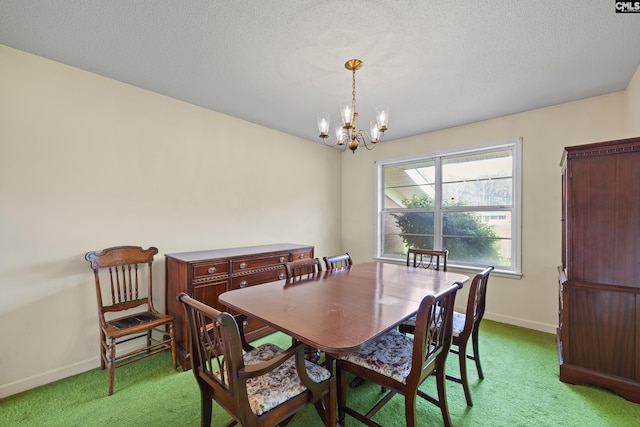 dining room with a textured ceiling, a notable chandelier, light colored carpet, and baseboards