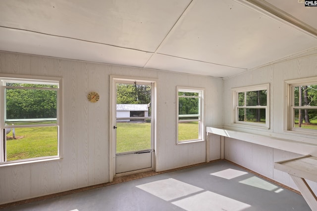 unfurnished sunroom featuring plenty of natural light