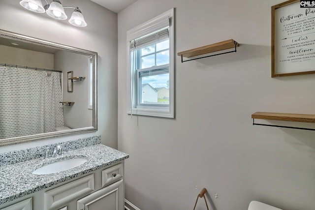 full bathroom featuring a shower with curtain and vanity