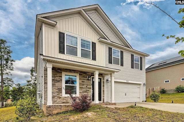 view of front of property featuring a garage, board and batten siding, concrete driveway, and stone siding