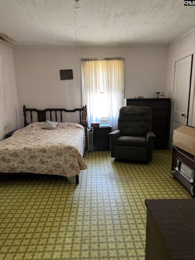 bedroom featuring ornamental molding, carpet flooring, and wooden ceiling