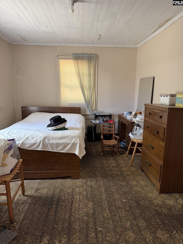 bedroom featuring crown molding and wood ceiling