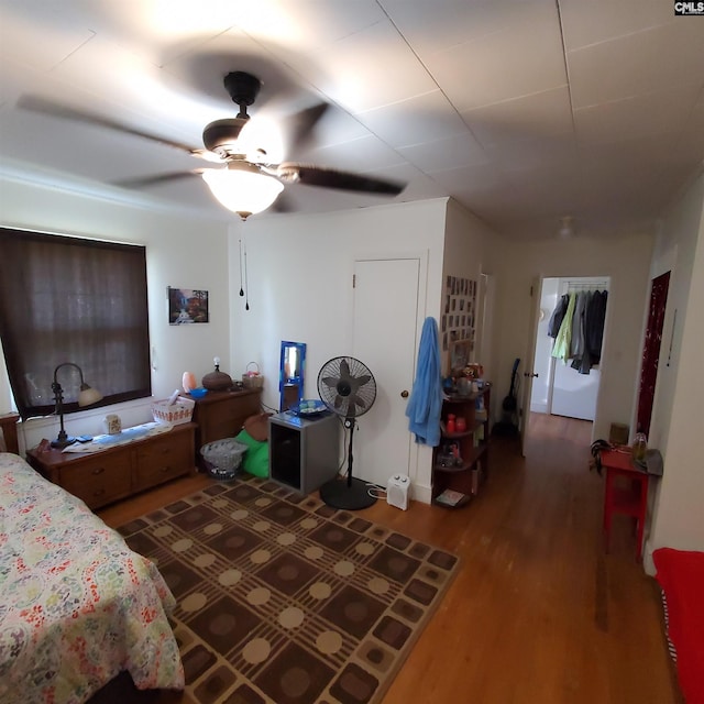 bedroom with ceiling fan and wood finished floors