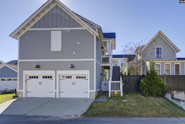 821 Harborside Ln, Columbia, SC 29229 - traditional home featuring fence, stairs, board and batten siding, an attached garage, and driveway