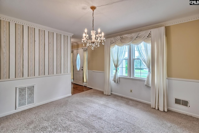 unfurnished dining area featuring baseboards, visible vents, a notable chandelier, and carpet floors