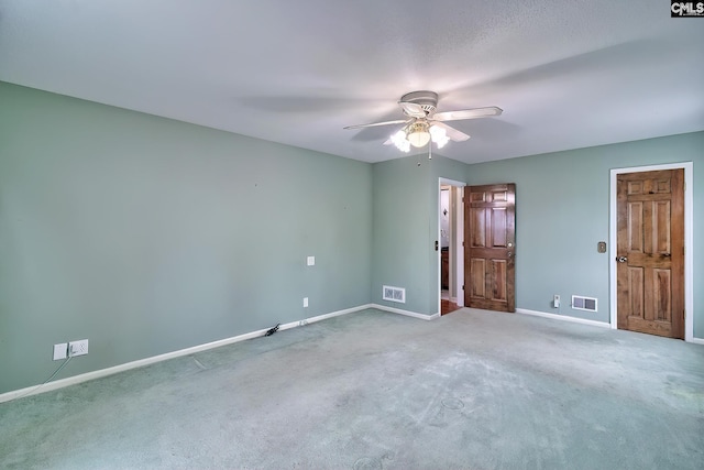 unfurnished bedroom with visible vents, carpet, and baseboards