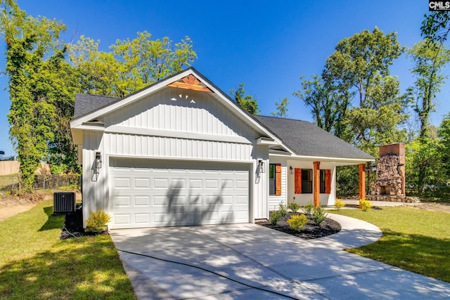 modern inspired farmhouse featuring a front lawn, a garage, driveway, board and batten siding, and roof with shingles