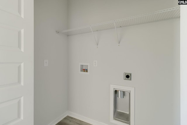 washroom with washer hookup, electric dryer hookup, baseboards, wood finished floors, and laundry area