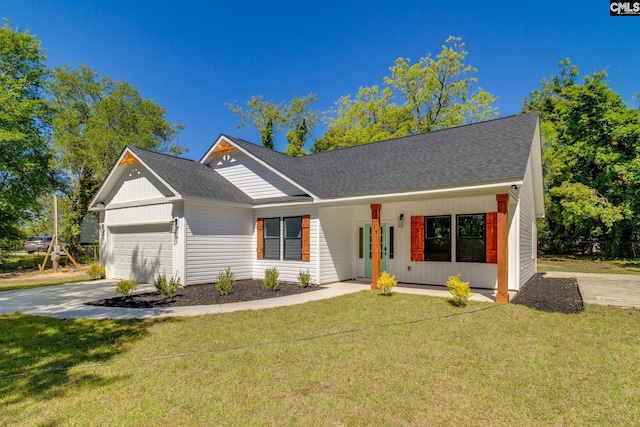 view of front of property featuring a garage, a front lawn, covered porch, and a shingled roof