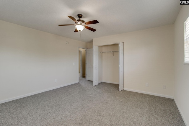 unfurnished bedroom with ceiling fan, light colored carpet, and baseboards