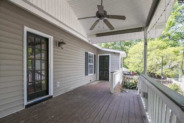 wooden terrace featuring ceiling fan