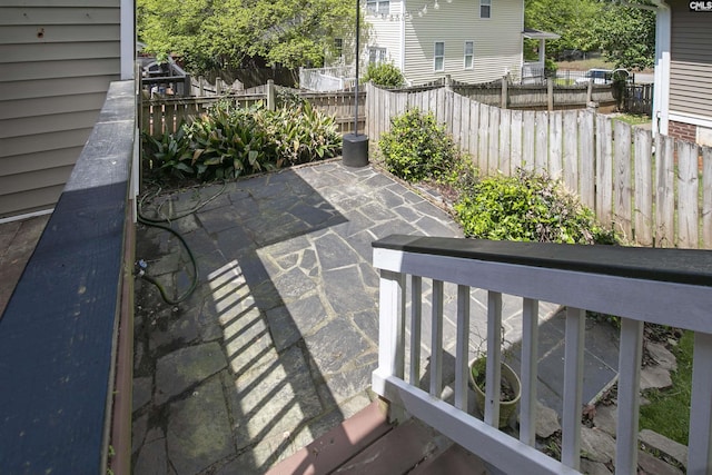 view of patio featuring fence