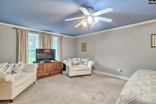 living area with carpet floors, a ceiling fan, and ornamental molding
