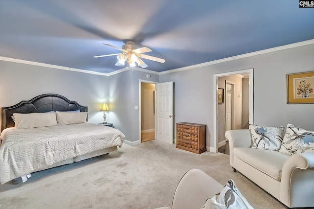 carpeted bedroom featuring crown molding, baseboards, and ceiling fan