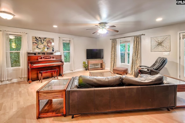 living room featuring recessed lighting, baseboards, ceiling fan, and wood finished floors