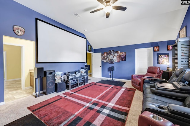 carpeted cinema featuring a ceiling fan, baseboards, visible vents, and lofted ceiling