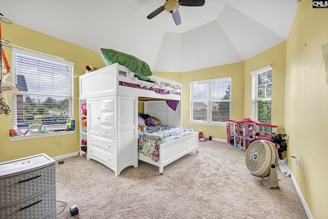 bedroom featuring baseboards, vaulted ceiling, and light colored carpet