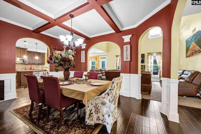 dining room featuring beam ceiling, coffered ceiling, arched walkways, dark wood finished floors, and a notable chandelier