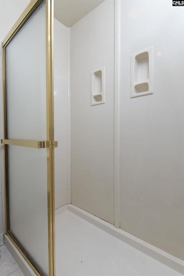 bathroom featuring an enclosed shower