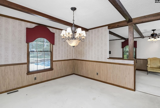 unfurnished dining area with visible vents, wainscoting, beamed ceiling, wallpapered walls, and a notable chandelier