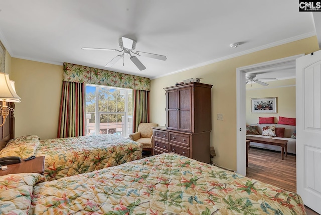 bedroom with crown molding, ceiling fan, and wood finished floors
