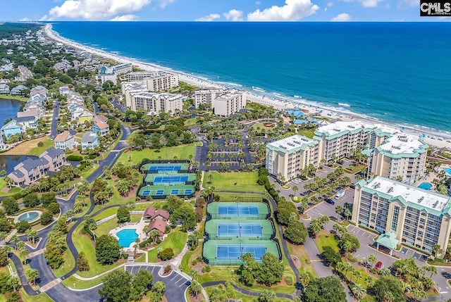drone / aerial view featuring a beach view and a water view