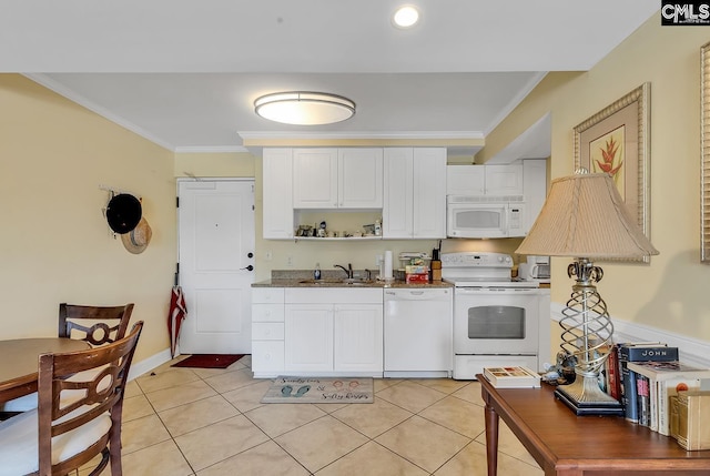 kitchen with white appliances, white cabinetry, crown molding, and a sink
