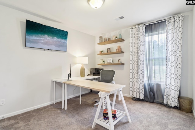 office space featuring visible vents, carpet flooring, and baseboards