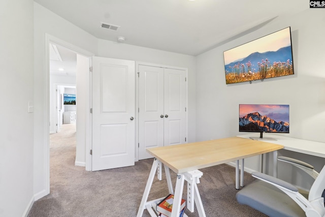 carpeted home office with baseboards and visible vents