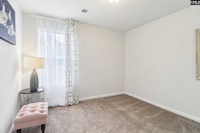 unfurnished room featuring visible vents, baseboards, and carpet floors