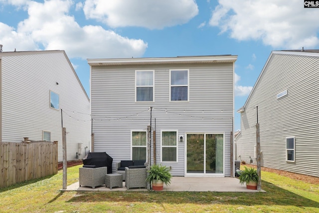 rear view of house featuring fence, a patio, a yard, and outdoor lounge area