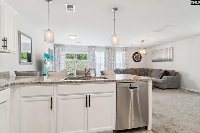 kitchen with visible vents, open floor plan, white cabinets, a sink, and dishwasher
