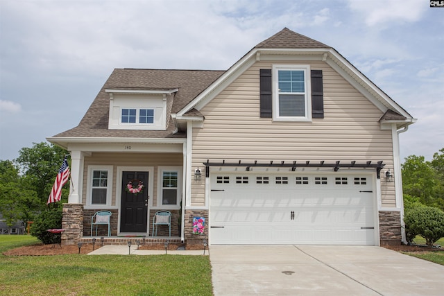 craftsman inspired home featuring concrete driveway, a shingled roof, stone siding, and a garage
