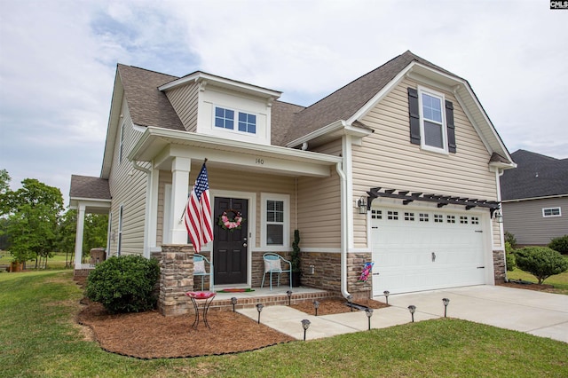 craftsman inspired home with a garage, covered porch, driveway, and roof with shingles