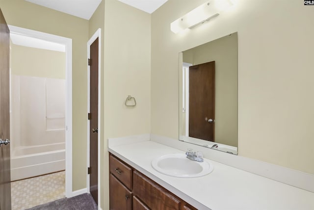 bathroom featuring vanity and baseboards