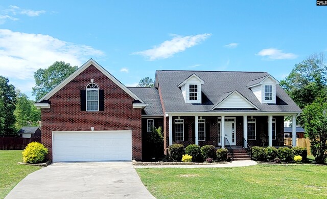 24 Mauser Dr, Lugoff, SC 29078 - cape cod house featuring concrete driveway, an attached garage, fence, and a front lawn