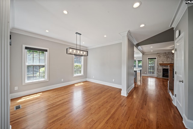 unfurnished dining area featuring crown molding, baseboards, and visible vents
