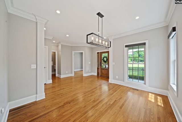 unfurnished dining area featuring light wood-style floors, ornamental molding, baseboards, and recessed lighting