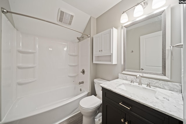 full bath with vanity, toilet, wood finished floors, shower / bathing tub combination, and visible vents