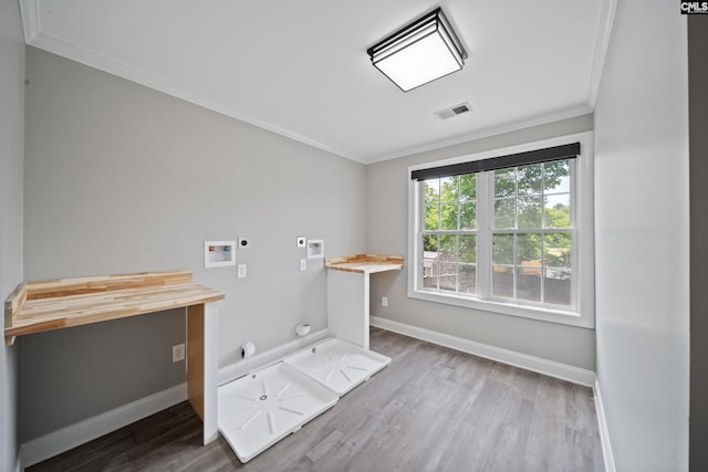 clothes washing area featuring gas dryer hookup, hookup for an electric dryer, laundry area, crown molding, and hookup for a washing machine