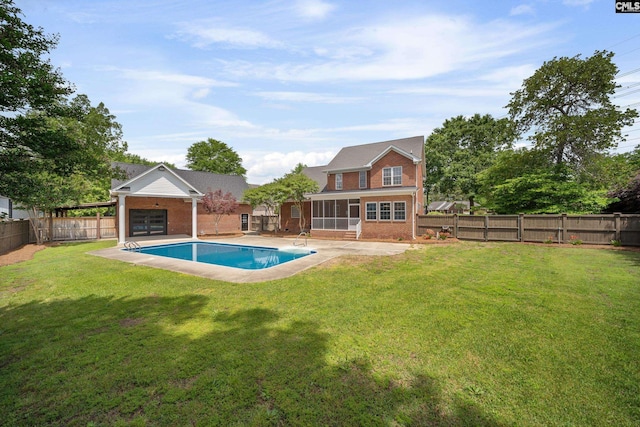 view of swimming pool with a sunroom, a fenced backyard, a fenced in pool, a patio area, and a yard