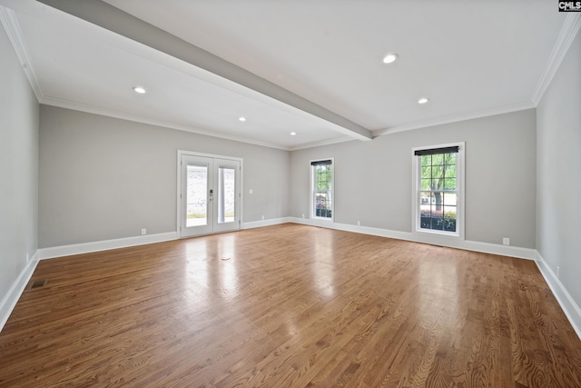 spare room with baseboards, ornamental molding, recessed lighting, and wood finished floors