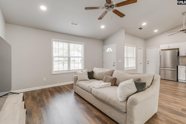 living room with visible vents, a ceiling fan, lofted ceiling, and recessed lighting