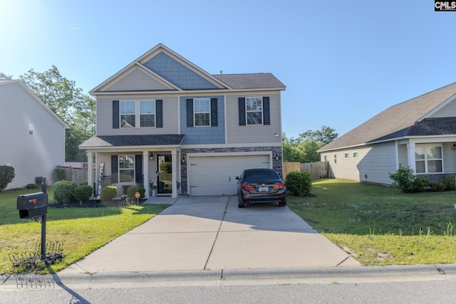 view of front of house featuring fence, an attached garage, driveway, and a front yard