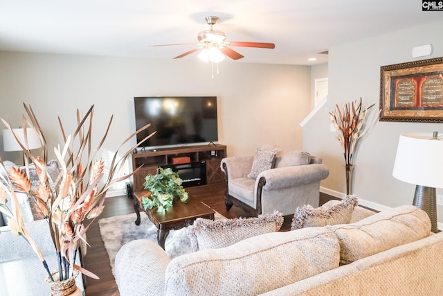 living room with baseboards, recessed lighting, ceiling fan, and wood finished floors
