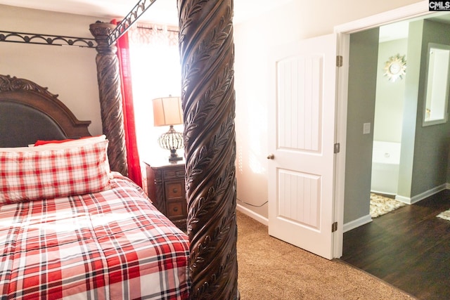 carpeted bedroom featuring baseboards