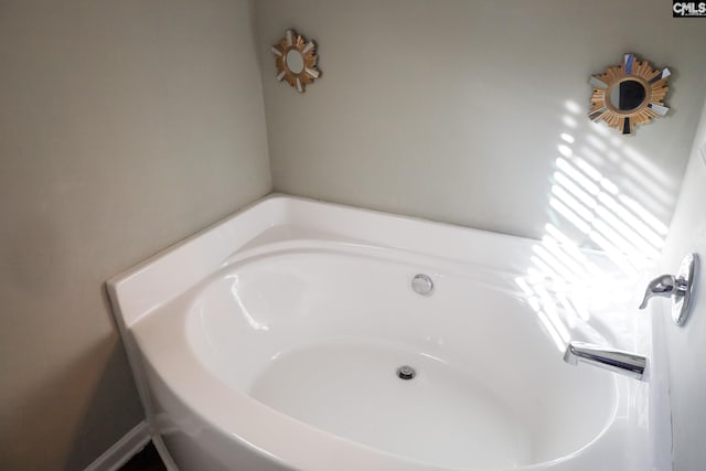 full bath with a garden tub